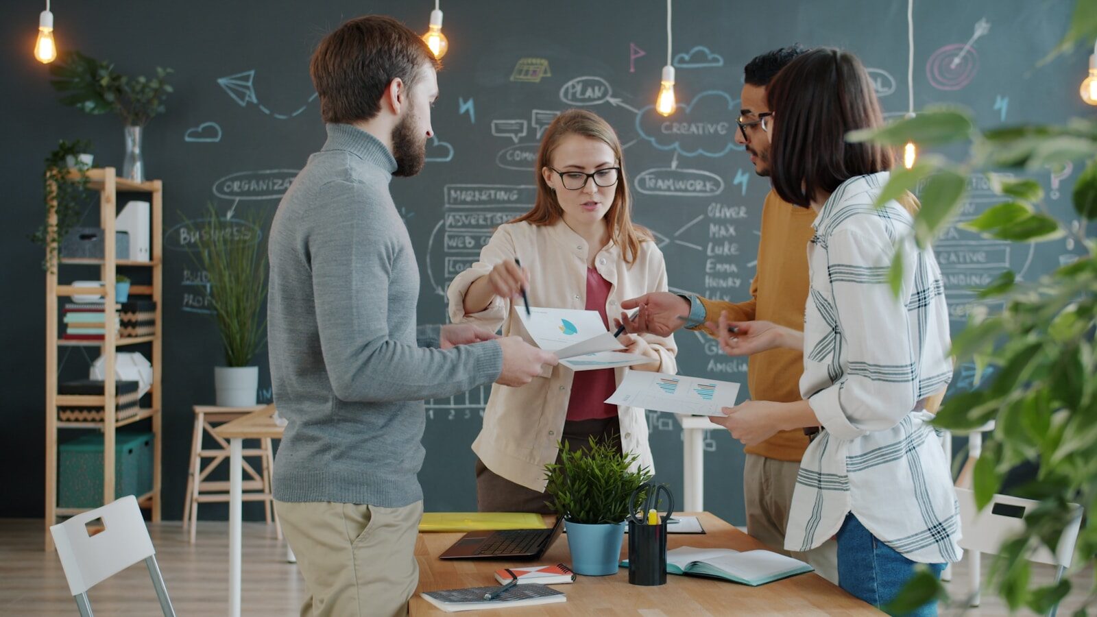 Colleagues collaborating around a table in an office